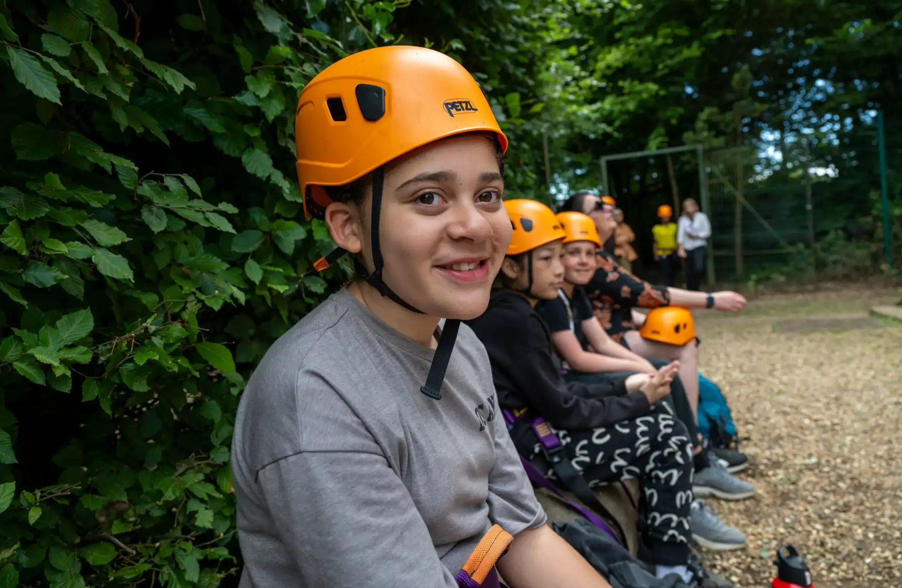 Boy wearing abseiling gear