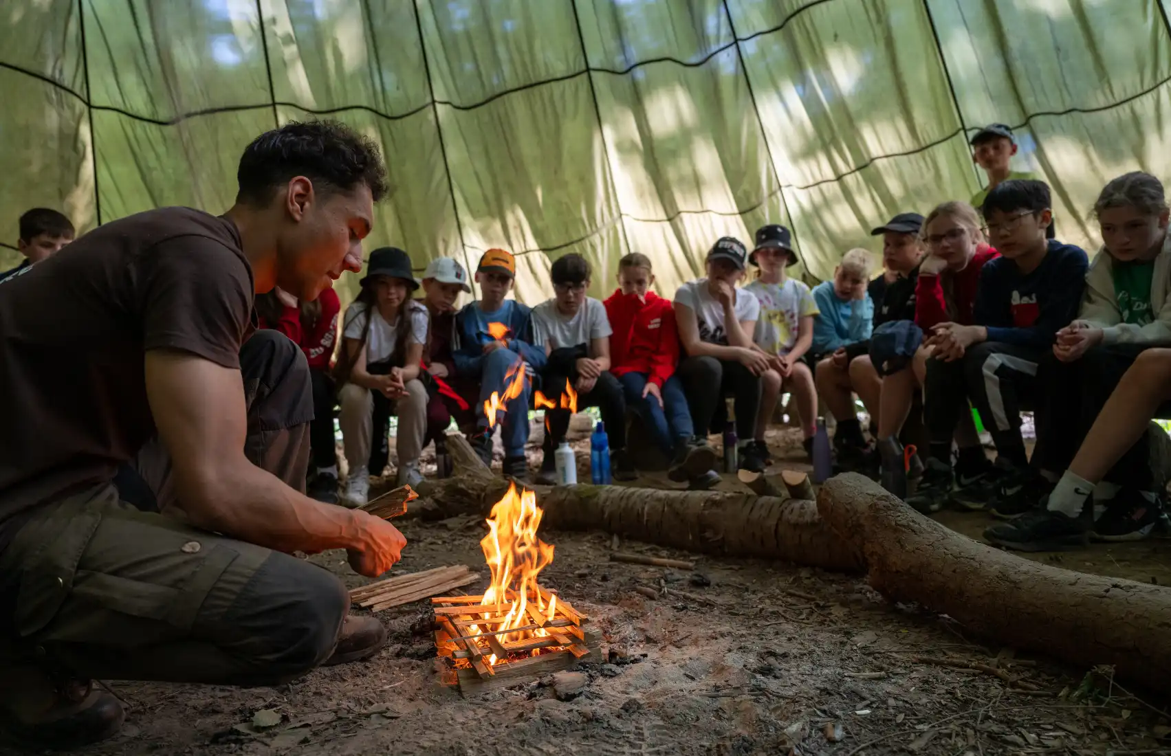 Bushcraft instructor lighting a fire